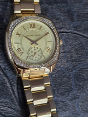  Shop Authentic Michael Kors Byrn Quartz Gold Dial Gold Steel Strap Watch For Women - MK6134 - Luxxuri