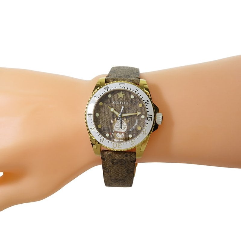  Shop Authentic Gucci Dive Doraemon Brown Dial Brown Leather Strap Watch For Men - YA136334 - Luxxuri