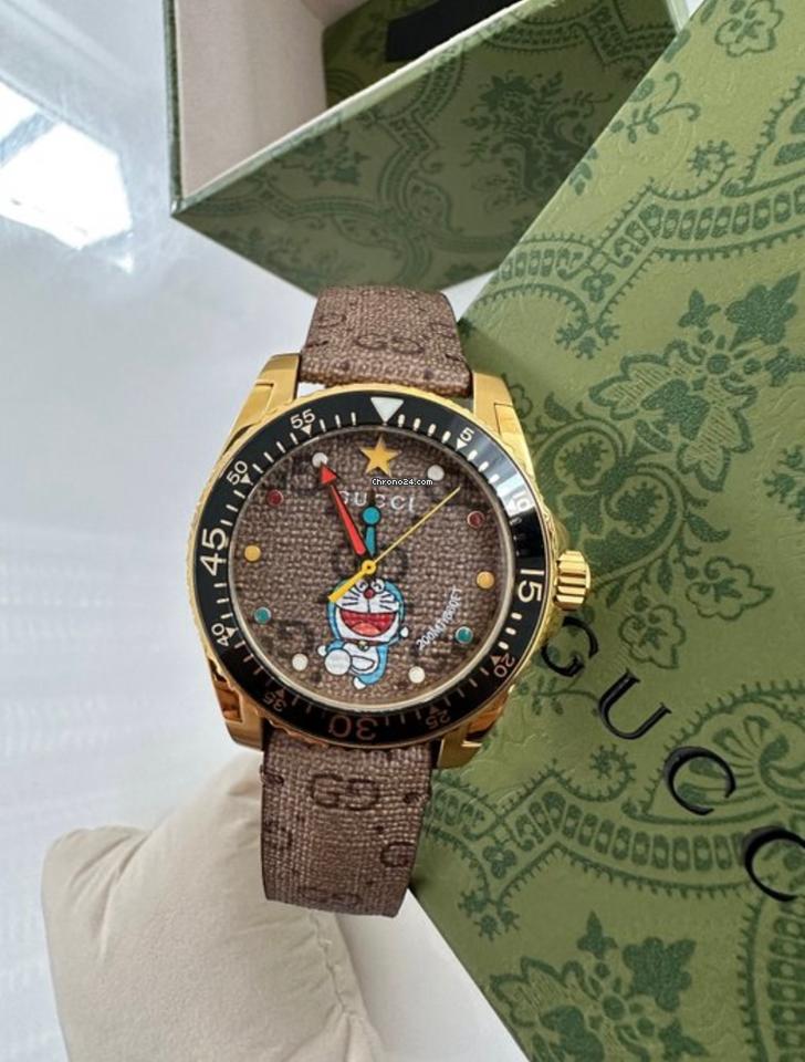  Shop Authentic Gucci Dive Doraemon Quartz Brown Dial Brown Leather Strap Watch For Men - YA136335 - Luxxuri