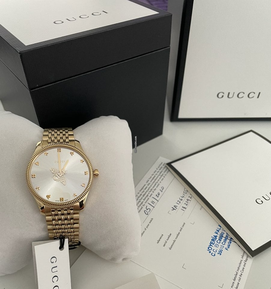  Shop Authentic Gucci G Timeless Quartz Silver Dial Gold Steel Strap Watch For Women - YA1264155 - Luxxuri