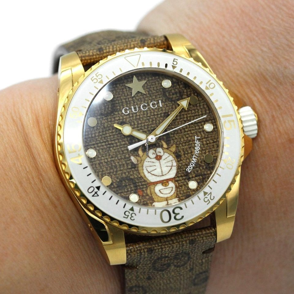  Shop Authentic Gucci Dive Doraemon Brown Dial Brown Leather Strap Watch For Men - YA136334 - Luxxuri