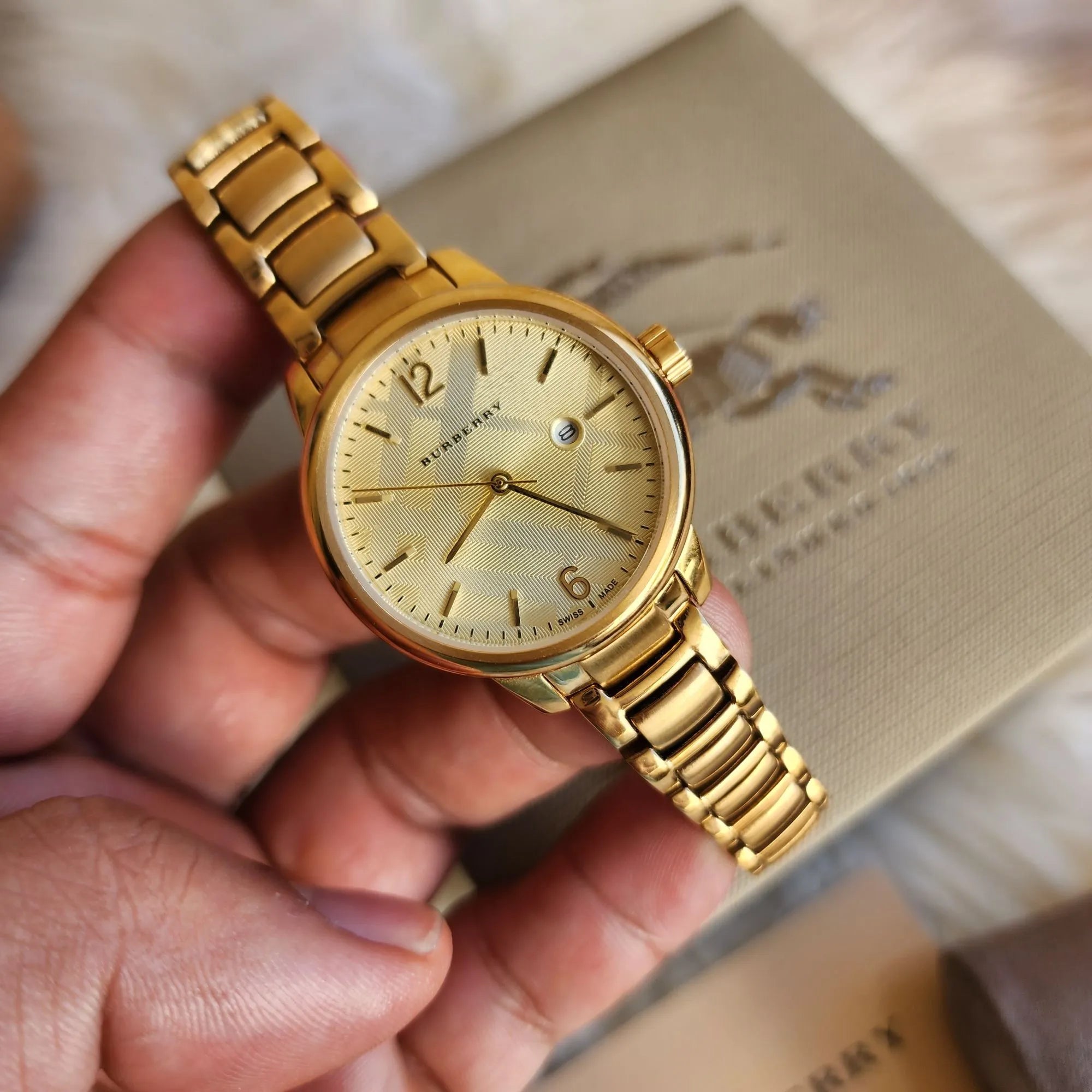  Shop Authentic Burberry The Classic Champagne Dial Gold Steel Strap Watch for Women - BU10109 - Luxxuri