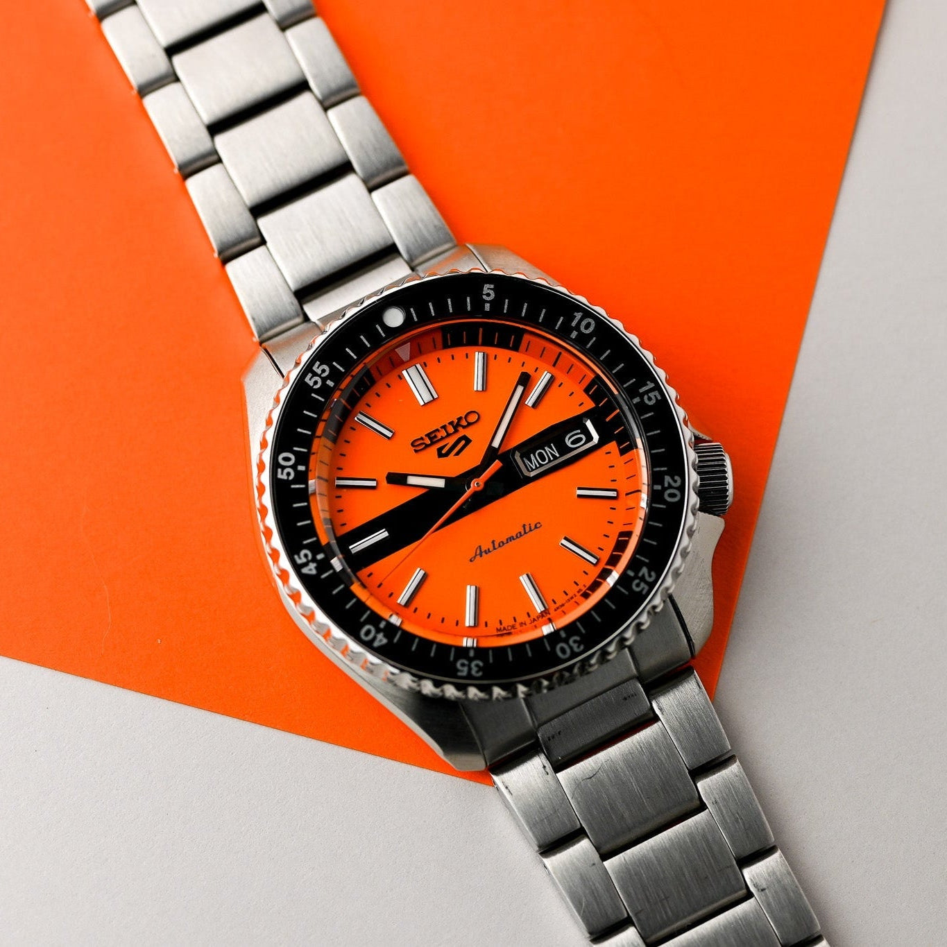  Shop Authentic Seiko 5 Sports Double Hurricane Retro Orange Dial Silver Steel Strap Watch For Men - SRPK11K1 - Luxxuri