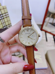  Shop Authentic Burberry The Classic Champagne Gold Dial Brown Leather Strap Watch for Women - BU10101 - Luxxuri