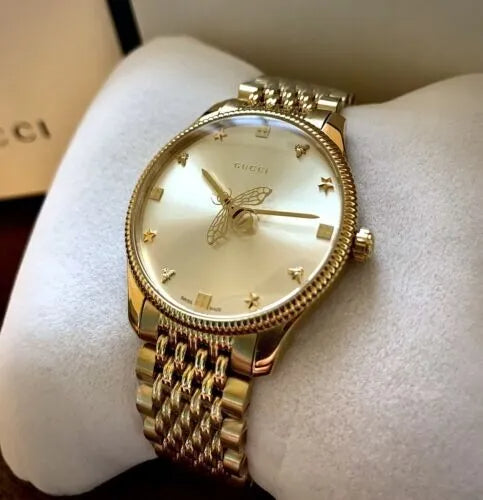  Shop Authentic Gucci G Timeless Quartz Silver Dial Gold Steel Strap Watch For Women - YA1264155 - Luxxuri
