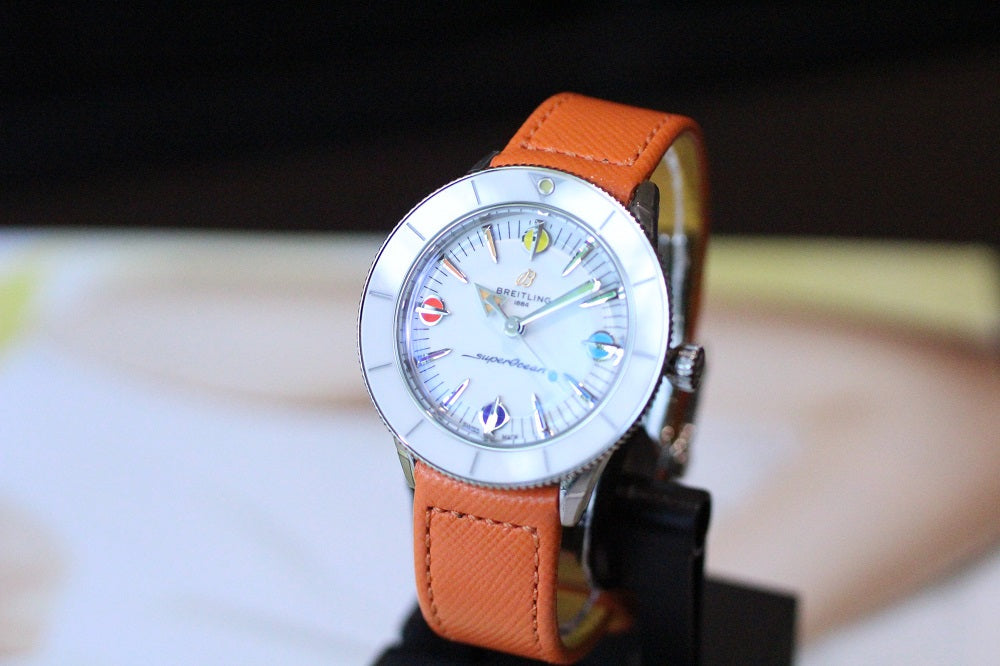  Shop Authentic Breitling Superocean Heritage '57 Pastel Paradise White Dial Orange Leather Watch for Women - A10340A11A1X1 - Luxxuri