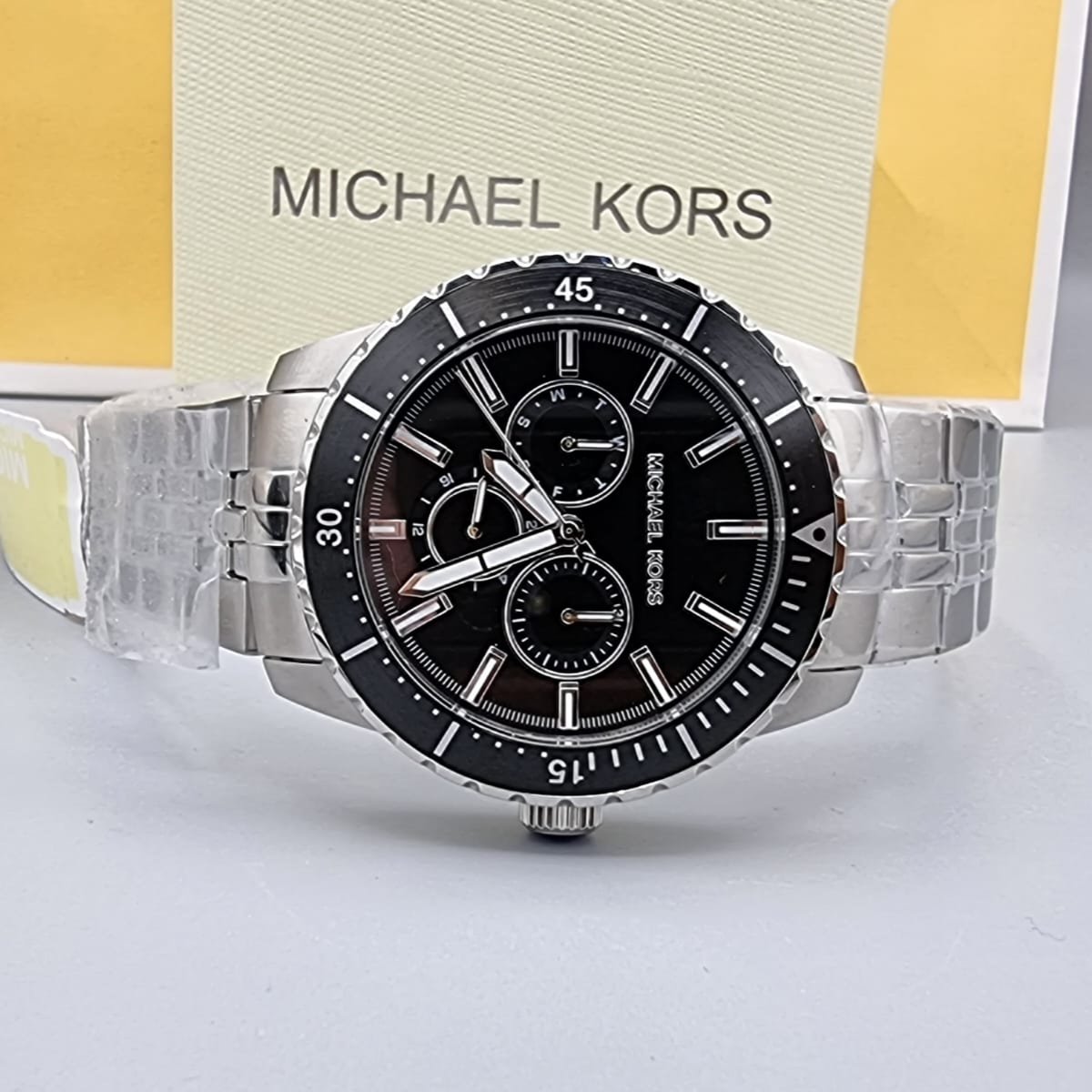  Shop Authentic Michael Kors Cunningham Multifunction Black Dial Silver Steel Strap Watch For Men - MK7156 - Luxxuri