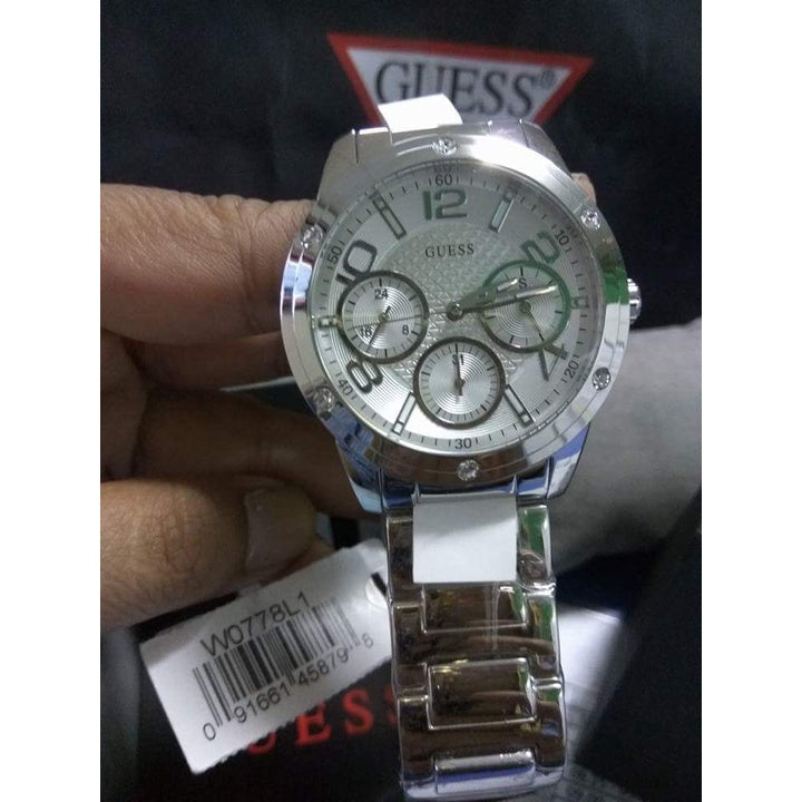  Shop Authentic Guess Confetti Silver Dial Silver Steel Strap Watch for Women - W0778L1 - Luxxuri
