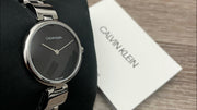  Shop Authentic Calvin Klein Wavy Black Dial Silver Steel Strap Watch for Women - K9U23141 - Luxxuri