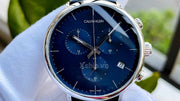  Shop Authentic Calvin Klein High Noon Chronograph Blue Dial Black Leather Strap Watch for Men - K8M271CN - Luxxuri