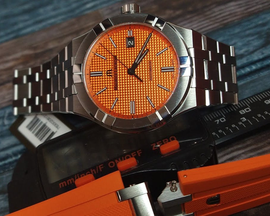  Shop Authentic Maurice Lacroix Aikon Automatic Date Orange Dial Silver Steel Strap Watch For Men - AI6008-SS00F-530-E - Luxxuri