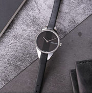  Shop Authentic Calvin Klein Rebel Black Grey Dial Black Leather Strap Watch for Women - K8P231C1 - Luxxuri
