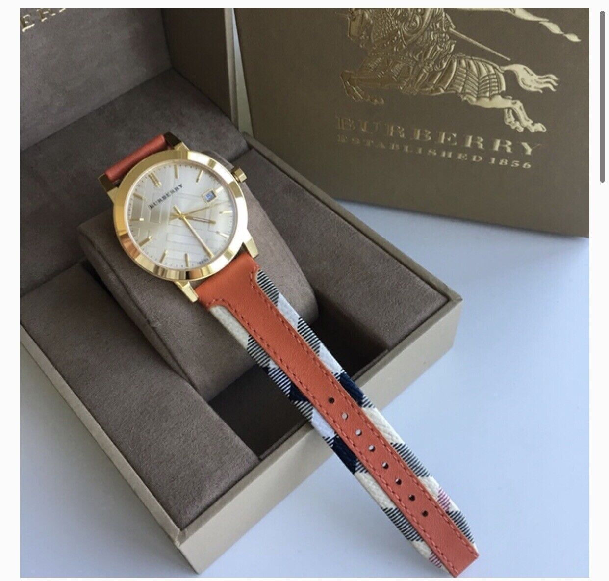  Shop Authentic Burberry The City Gold Dial Orange Leather Strap Watch for Women - BU9016 - Luxxuri