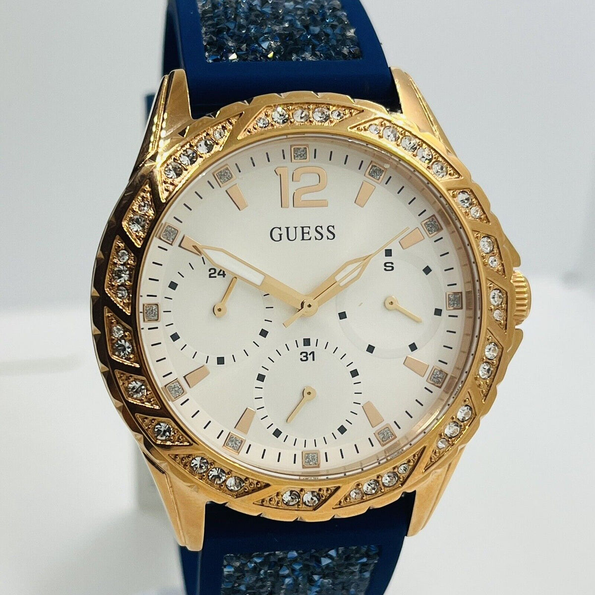  Shop Authentic Guess Swirl Analog Quartz White Dial Blue Rubber Strap Watch for Women - W1096L4 - Luxxuri