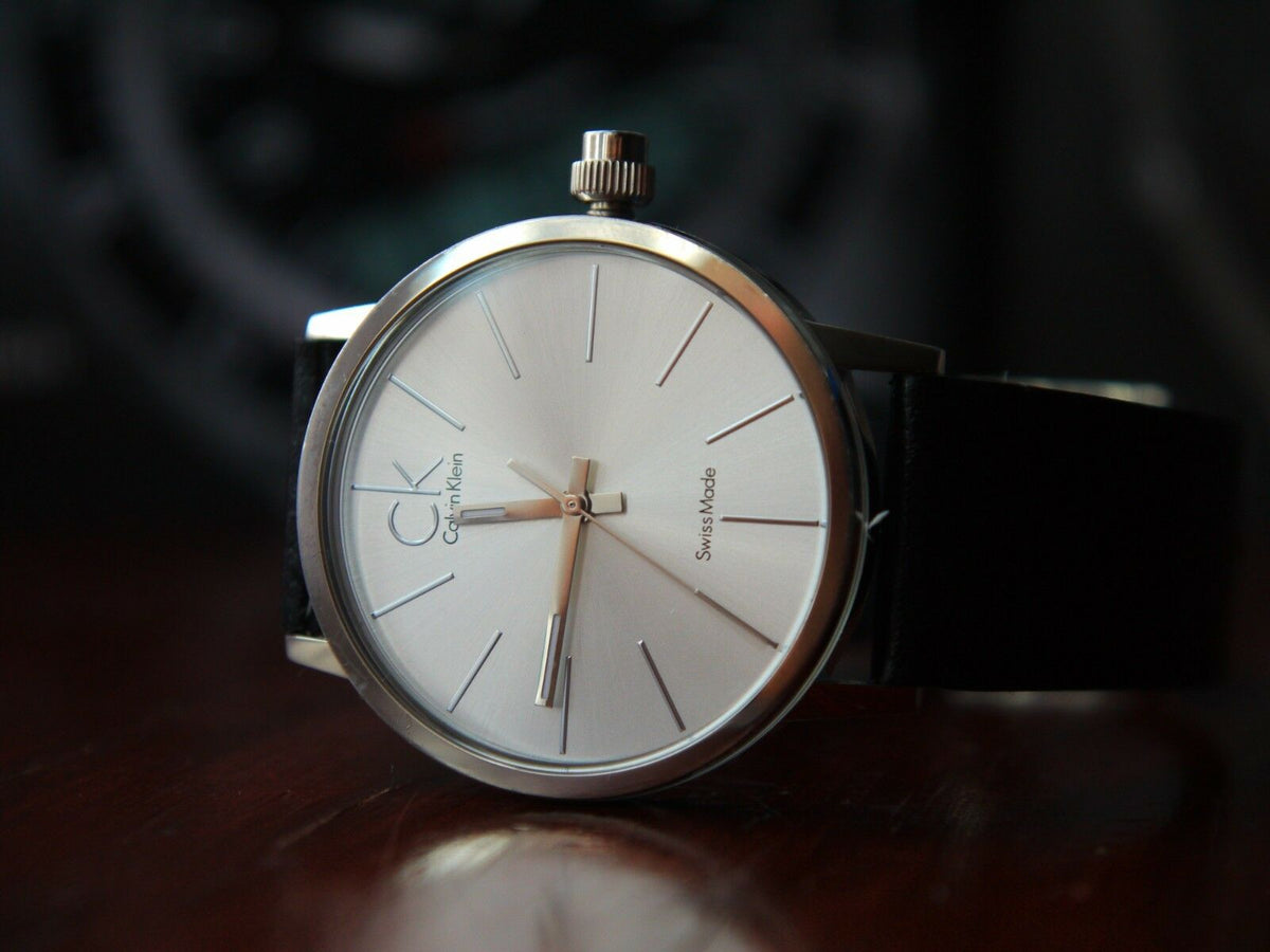  Shop Authentic Calvin Klein Post Minimal Silver Dial Black Leather Strap Watch for Men - K7621192 - Luxxuri